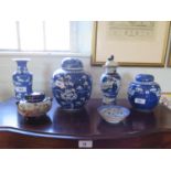A Chinese blue and white prunus design ginger jar and cover, 21 cm high, another smaller, 15 cm