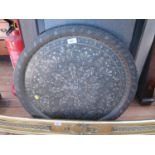 An Indian brass and silvered tray, circular with radiating tree design, 60 cm diameter