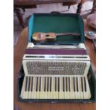 A Hohner Tango III Accordion, with three ocatve keyboard, cased, and a ukulele (2)