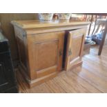 A walnut cabinet, the panelled twin doors enclosing drawers and shelves, 77 cm wide, 35.5 cm deep,