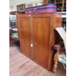 A mahogany bookcase top, with twin panelled doors enclosing adjustable shelves, 103.5 cm wide (