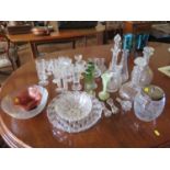 Three Edwardian etched glass decanters and stoppers, a pair of green glass vases with silver rims,