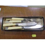 A boxed set of fish knives and forks