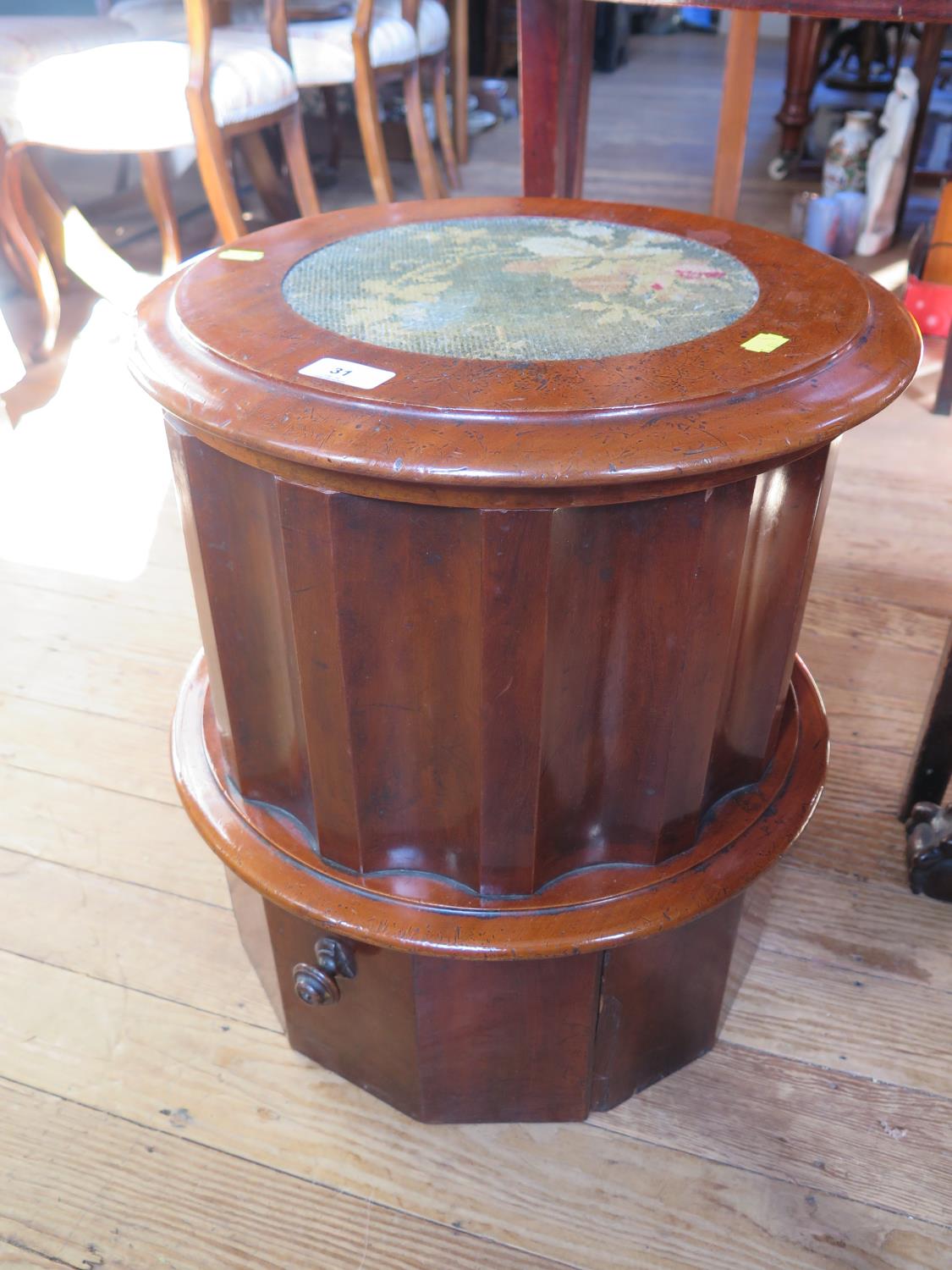 A Victorian mahogany commode, of cylindrical form with fluted sides and pedestal base with pullout