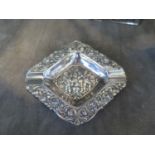 A highly decorated Continental silver ashtray, 800 standard