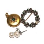 A pair of pearl earrings, a cats eye brooch, a round hair locket, etc