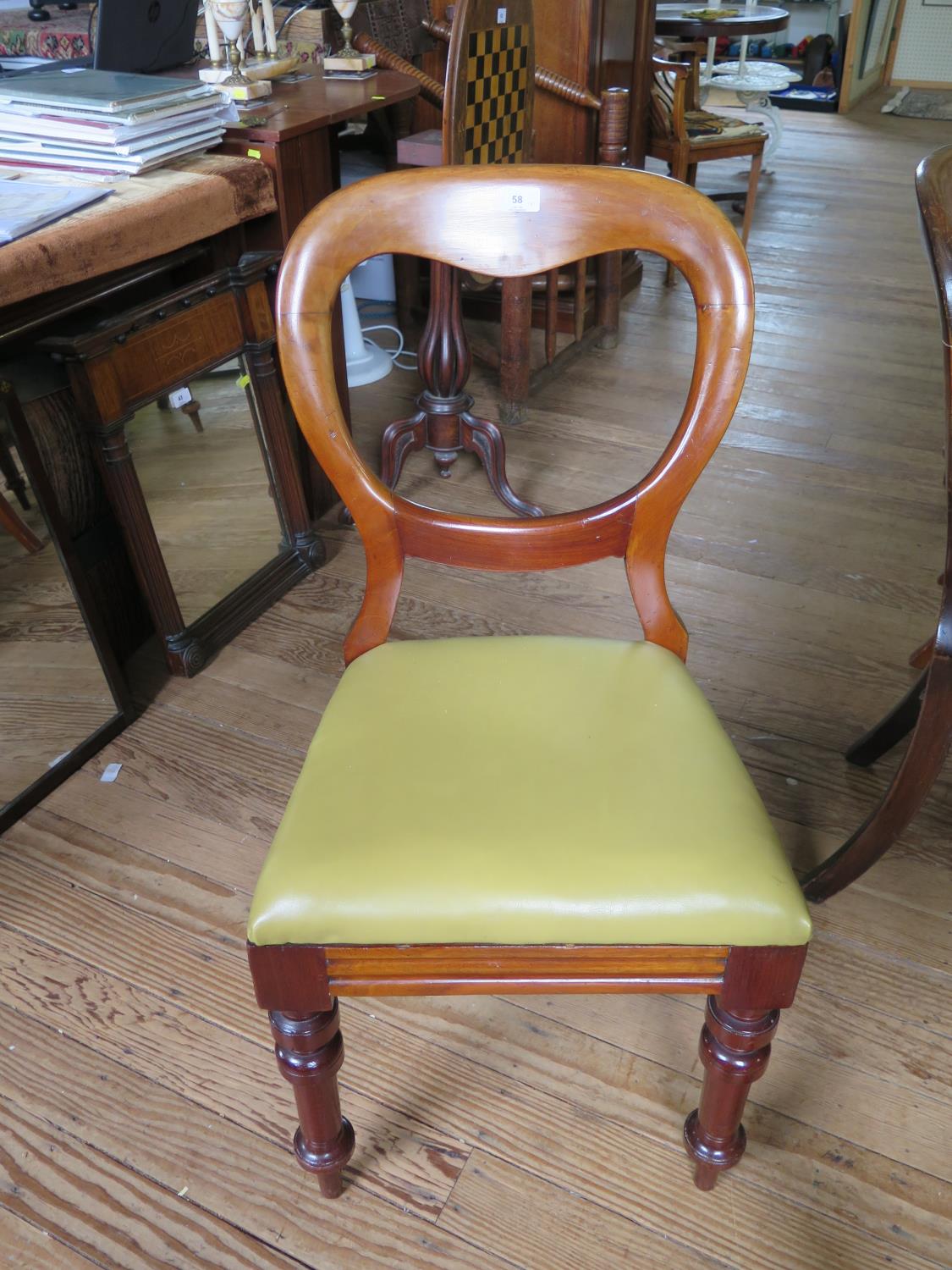 A set of eight mid Victorian balloon back dining chairs, with drop in seats on turned tapering