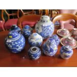 A Chinese blue and white prunus design ginger jar and cover, 20 cm high, and eight other ginger jars