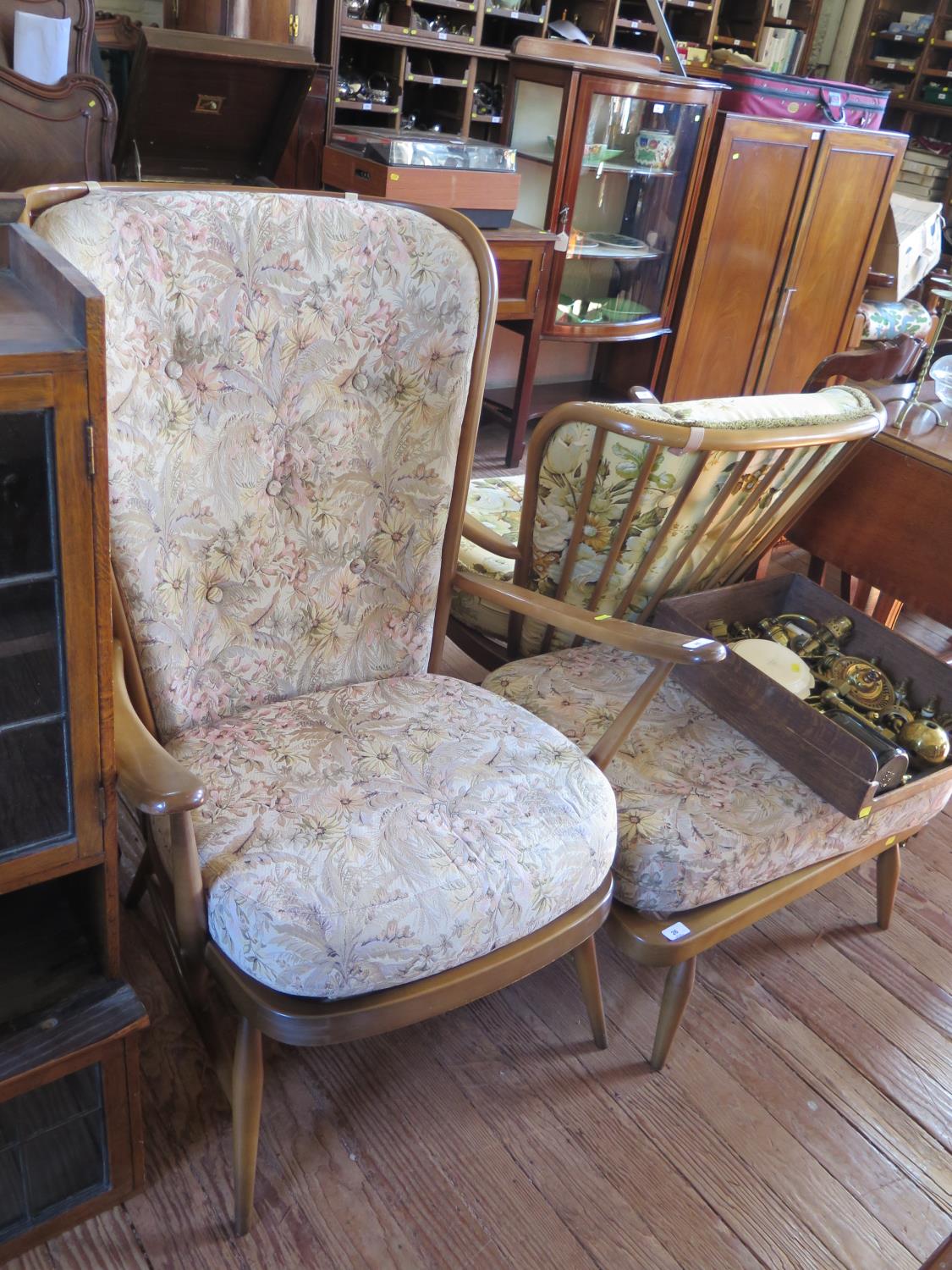 An Ercol ash spindle back armchair and stool, labelled under the seat (2)