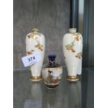 A pair of Japanese Meiji period miniature vases, of tapering form depicting foliate branches, 11.5