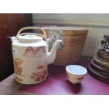 A Chinese teapot and two tea bowls, depicting figures and fishermen among islands, in a fitted