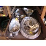 A plated entree dish, two gravy boats, two ladles, milk jug and sugar bowl
