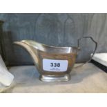 An Art Deco style silver milk jug, 15 cm wide