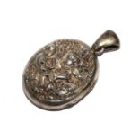 A silver locket, possibly Burmese