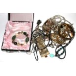 A bag of assorted costume jewellery