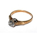 A 9 carat gold ring set with faux diamonds