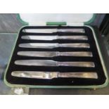 A cased set of six silver handled tea knives