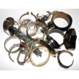 A bag of 21 assorted bangles and bracelets