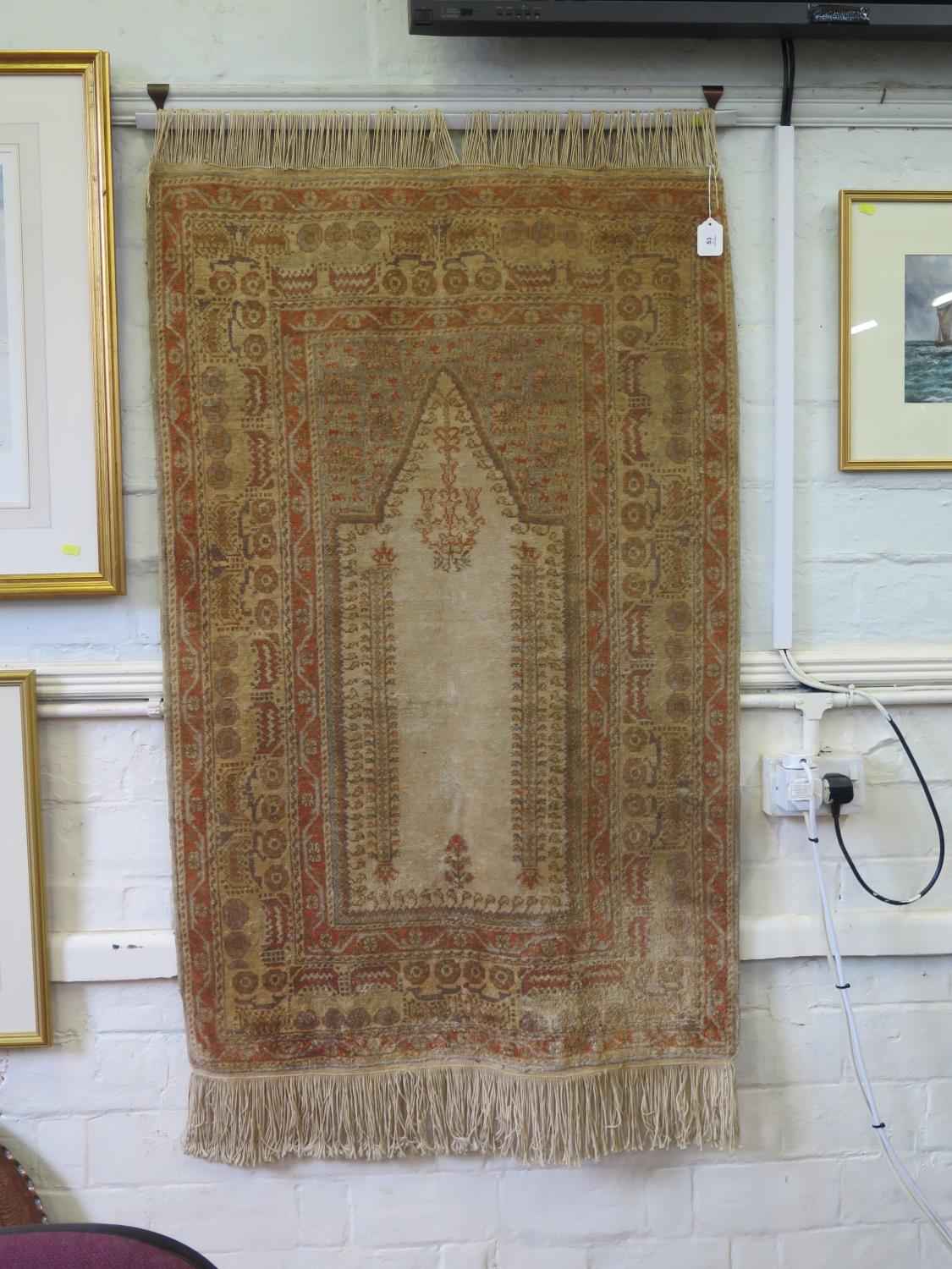 A Persian style prayer rug, the sand field within a multiple border with repeat pattern, 155 x 88 cm