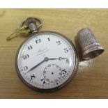 A silver pocket watch and a thimble