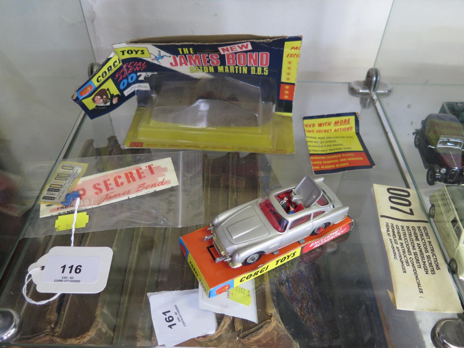 A Corgi silver 270 James Bond Aston Martin DB5 with instructions in paper packet, spare figure,