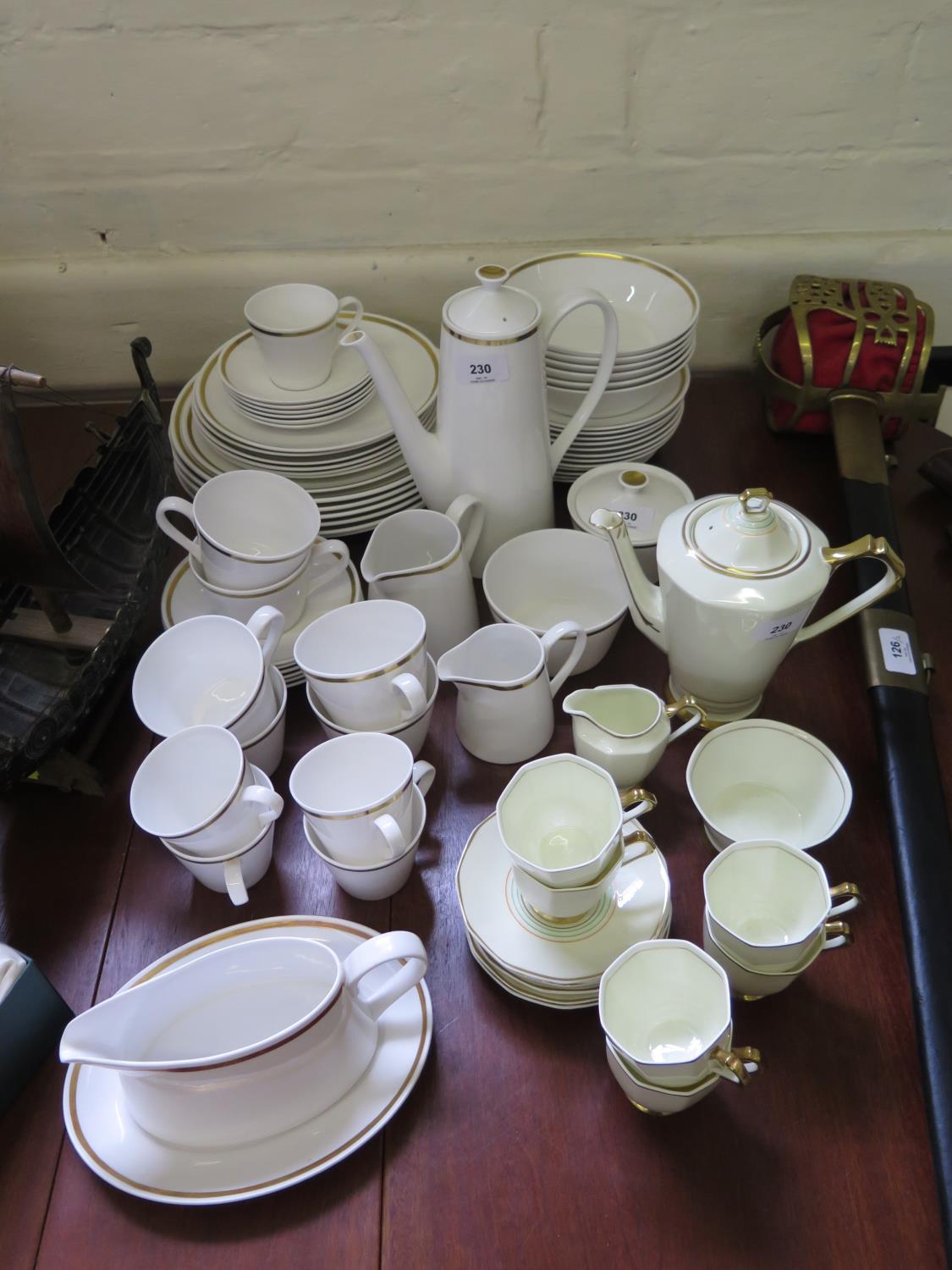 An Art Deco Tuscan China coffee service, with green and orange line decoration on a cream body,