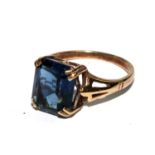 A 9 carat gold ring set with faux sapphire