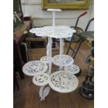 A Victorian painted cast iron three tier plant stand, in the style of Coalbrookdale, each tier