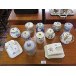 Ten Poole Pottery lidded jam pots and two cheese covers, all with floral designs