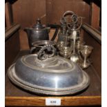 A tray of silver plate, including an entree dish, egg cup stand, condiment set and coffee pot