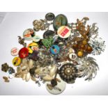A bag of miscellaneous costume jewellery and lapel badges