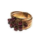 A ladies five section ring, each ring set with rubies