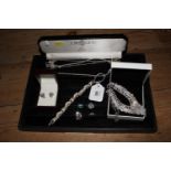 A boxed Warren James Swarovski crystal necklace, three other necklaces, a pair of earrings and