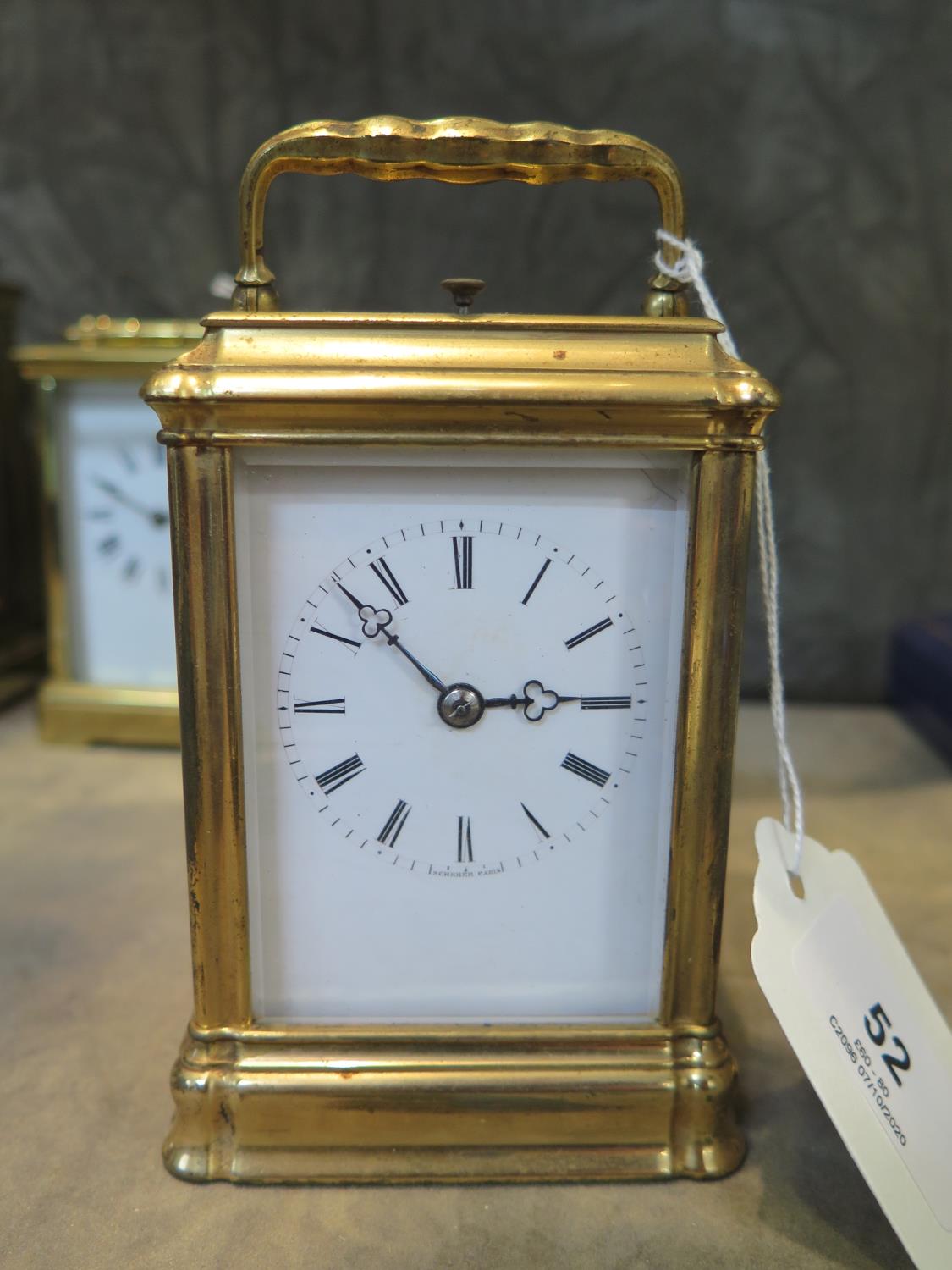 A brass carriage clock, the enamel dial inscribed Scherer Paris, the twin train repeating movement