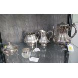 A silver plated mustard pot, a cut glass toilet jar with plated lid and a small shell shaped dish