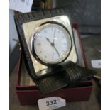 A silver travel alarm clock, Sheffield 2007 Roberts & Dore, in a black folding leather case, with