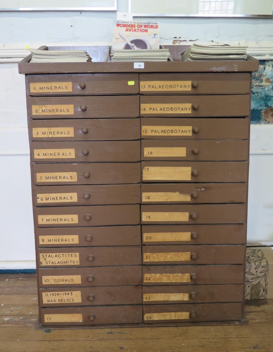 A painted pine collector's chest, the top with raised divisions over two banks of twelve labelled