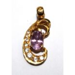 A pink sapphire pendant set in 22 carat gold
