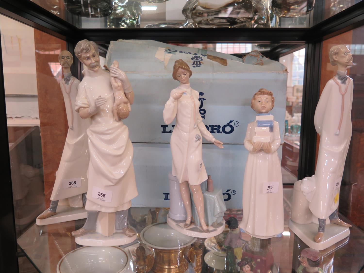 Two Lladro figures of a doctor, 36 cm high, another of an obstetrician, 36 cm high (with box),