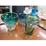 Four Whitefriars glass lobed vases, in green or blue, one with air bubbles, 23 cm high (4)