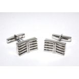 A pair of 18 carat white gold cufflinks set with diamonds