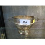 A silver two handled rose bowl shaped christening cup, 8.5 cm high