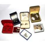 A bag containing nine assorted pairs of cufflinks