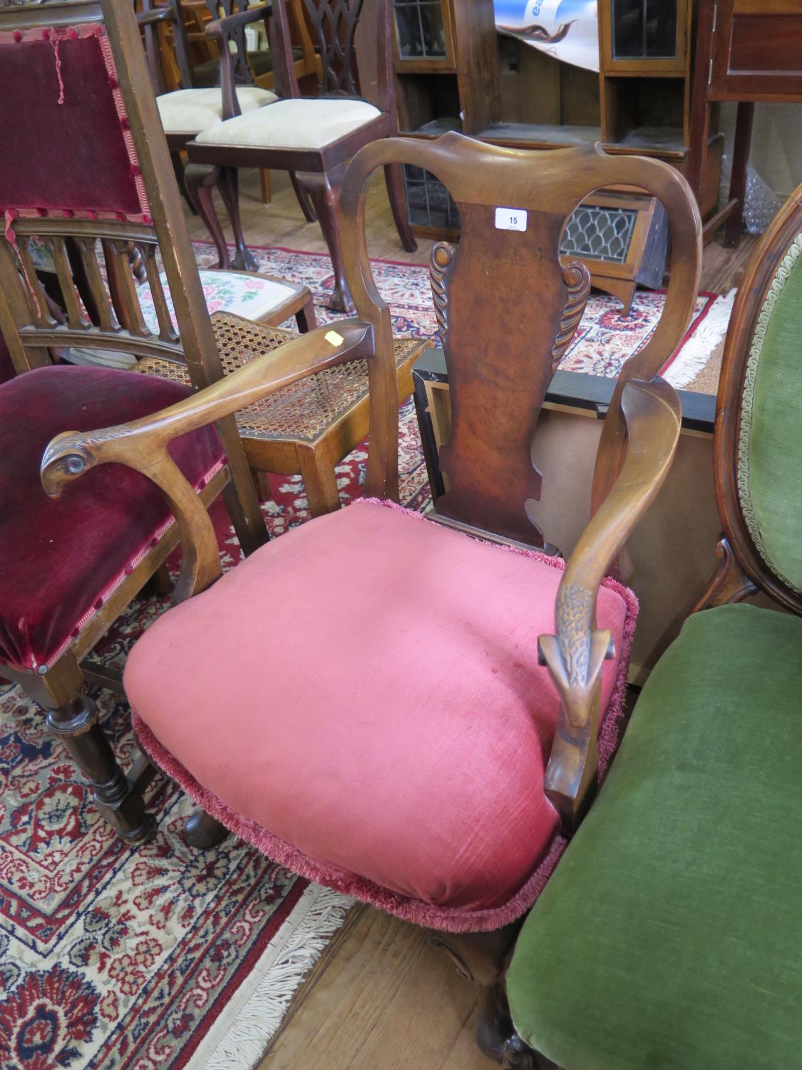 A Victorian walnut small armchair with rams head arms, upholstered in pink dralon velvet