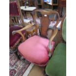 A Victorian walnut small armchair with rams head arms, upholstered in pink dralon velvet