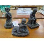 A Genesis cold cast bronzed figure of a seated boy titled "Toys" and two others