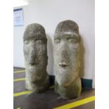 A pair of reconstituted stone heads, in the style of the Easter Island figures, 67 cm high (2)