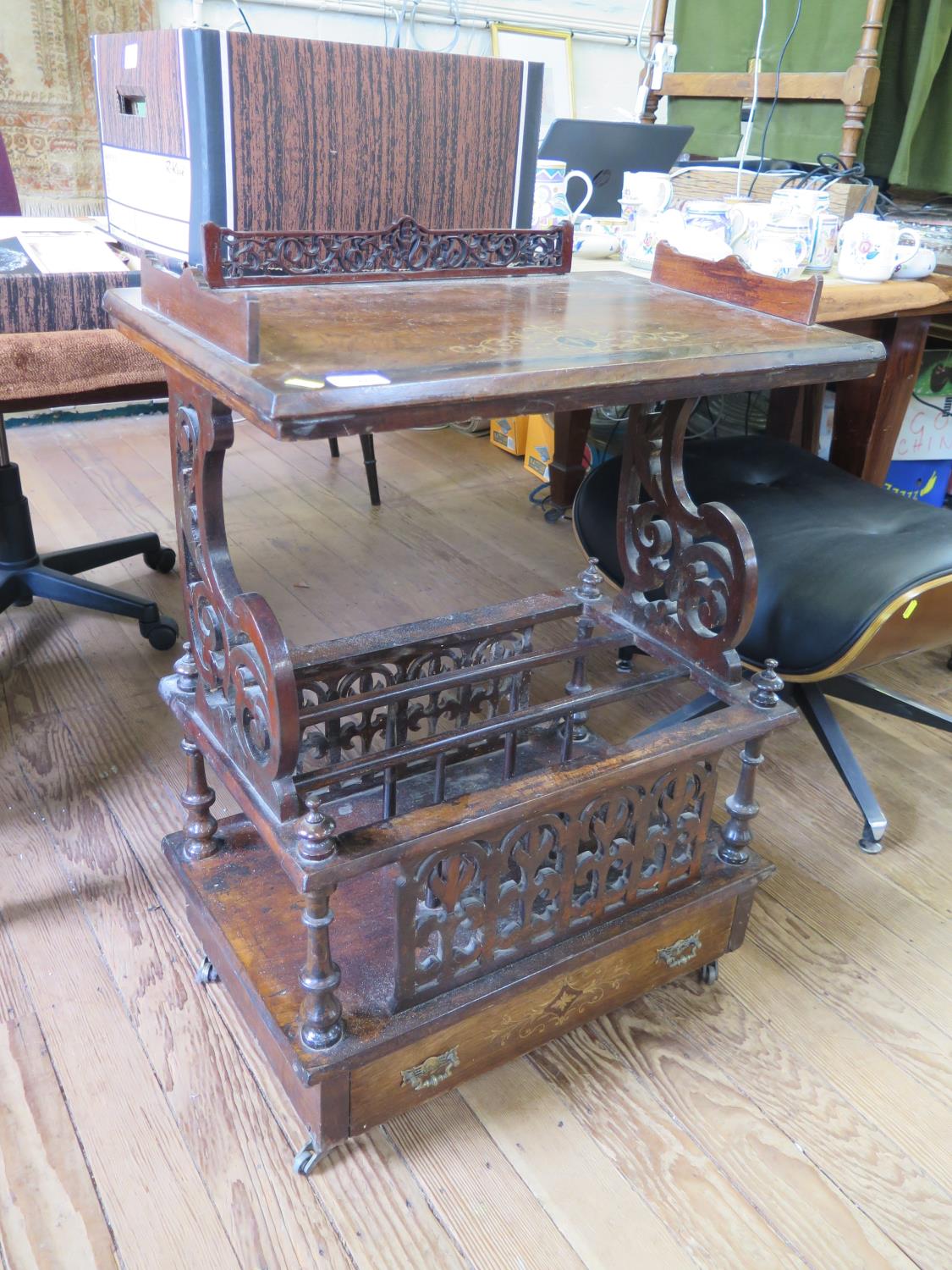 A Victorian inlaid walnut Canterbury, the rectangular top with part fret carved gallery over fret