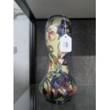 A Moorcroft Pottery gourd shape Hellebore pattern vase, 28 cm high