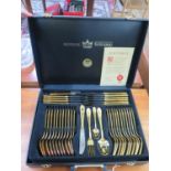 A gold plated cutlery set by SBS Bestecke Solingen, in a fitted case
